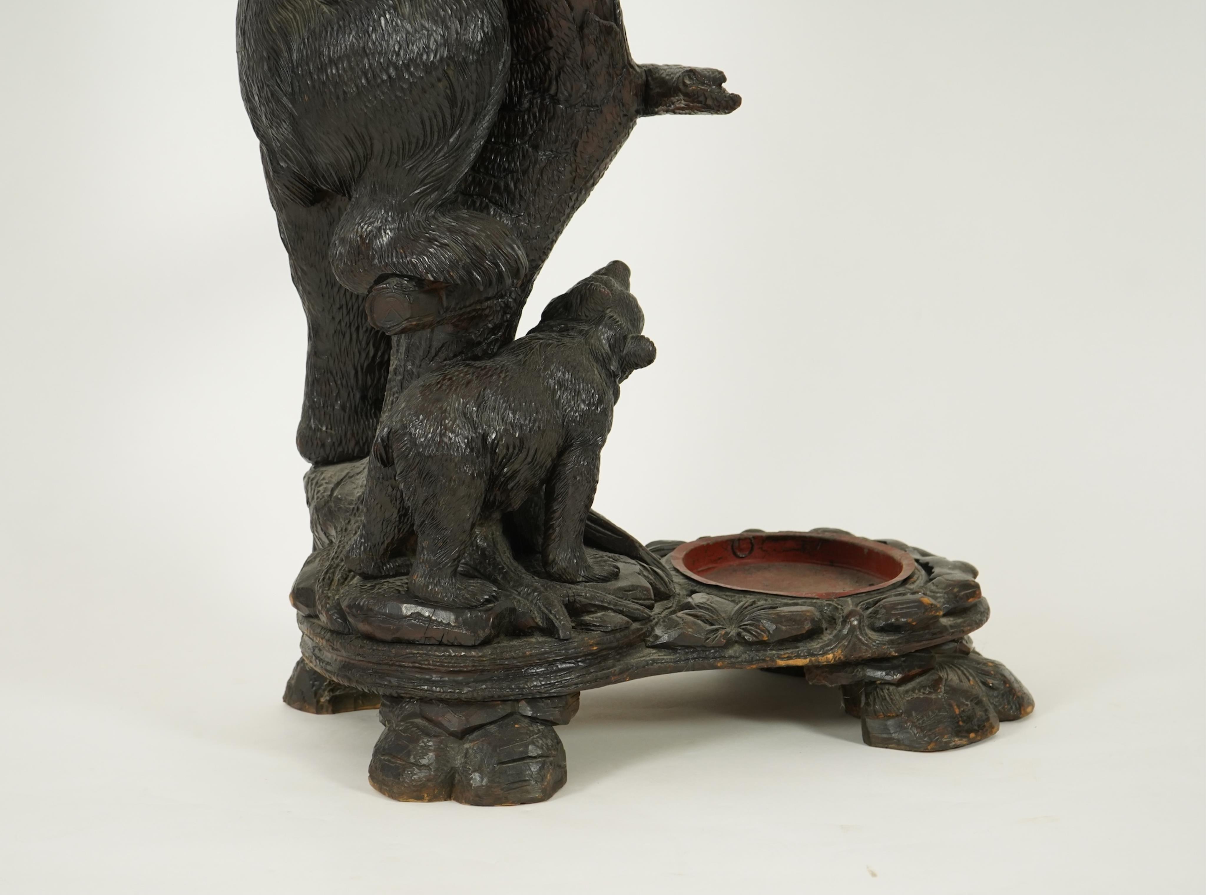 A late 19th century Black forest carved bear hallstand